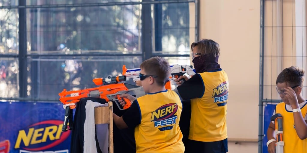 Two boys playing Nerf war